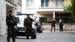 Armed soldiers secure the scene where French soliders were hit and injured by a vehicle in the western Paris suburb of Levallois-Perret, France, August 9, 2017. REUTERS/Benoit Tessier