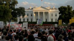 People gather for a vigil in response to the death of a counter-demonstrator at the "Unite the Right" rally in Charlottesville, outside the White House in Washington,