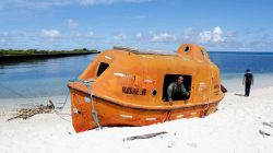 FILE PHOTO: A Filipino soldier looks out from a boat in Philippine occupied Thitu island in disputed South China Sea, April 21, 2017. REUTERS/Erik De Castro
