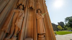 The empty plinth where a statue of Confederate commander General Robert E. Lee once stood is flanked by statues of Thomas Jefferson and the poet Sidney Lanier at the entrance to Duke University's Duke Chapel after officials removed the controversial statue early Saturday morning in Durham, North Carolina, U.S., August 19, 2017. REUTERS/Jason Miczek