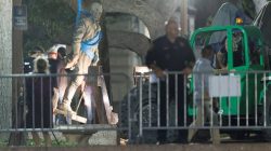 Workers remove Confederate General Robert E. Lee statue from the south mall of the University of Texas in Austin, Texas, U.S., August 21, 2017. REUTERS/Stephen Spillman