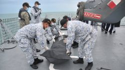 Royal Malaysian Navy personnel carry a body onto their ship during a search and rescue operation for survivors of the USS John McCain ship collision in Malaysian waters in this undated handout released August 22, 2017. Royal Malaysian Navy Handout via REUTERS