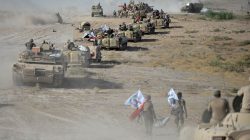 Shi'ite Popular Mobilization Forces (PMF) gather with Iraqi army on the outskirts of Tal Afar, Iraq, August 22, 2017. REUTERS/Stringer