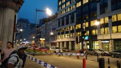 People walk next to the scene where a man attacked two soldiers with a knife in Brussels, Belgium August 25, 2017 in this picture obtained from social media. Picture taken August 25, 2017. Thomas Da Silva Rosa /via REUTERS