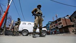 Indian policemen guard a deserted street during restrictions in downtown Srinagar April 10, 2017. REUTERS/Danish Ismail/Files