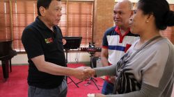 Philippine President Rodrigo Duterte greets Lorenza de los Santos and husband Saldy, parents of 17-year-old high school student Kian Delos Santos, who was killed recently in police raid in line with the war on drug, during their visit at Malacanang presidential complex in metro Manila, Philippines August 28, 2017