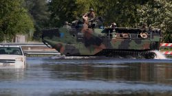 A Marine Corp vehicle patrols a flooded street as a result of Tropical Storm Harvey in Port Arthur, Texas, U.S., August 31, 2017.