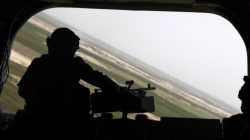 FILE PHOTO: The rear gunner of an Australian Chinook transport chopper mans a heavy machine gun during a low flight over the Arghandab valley in Kandahar province, southern Afghanistan, May 3, 2010. REUTERS/Yannis Behrakis