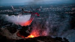 Water is dropped above homes in Sun Valley during the La Tuna Canyon fire over Burbank, California, U.S., September 2,
