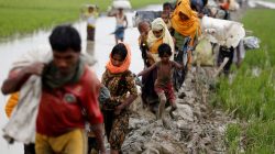 Rohingya refugees walk on the muddy path after crossing the Bangladesh-Myanmar border in Teknaf, Bangladesh, September 3, 2017. REUTERS/Mohammad Ponir Hossain