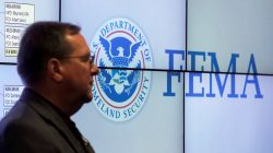 FILE PHOTO: A Federal Emergency Management Agency (FEMA) employee waits for the arrival of U.S. President Donald Trump during a visit at FEMA headquarters in Washington, U.S., August 4, 2017. REUTERS/Carlos Barria/File Photo