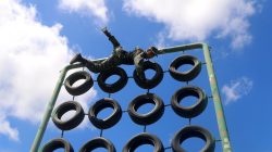 A Chinese paramilitary policeman climbs an obstacle during training in Nanning, Guangxi Zhuang Autonomous Region, China, August 11, 2017. Picture taken August 11, 2017. REUTERS/Stringer