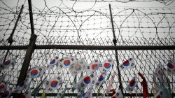 FILE PHOTO: South Korean national flags hang on a barbed-wire fence near the demilitarized zone separating the two Koreas in Paju, South Korea, August 14, 2017. REUTERS/Kim Hong-Ji