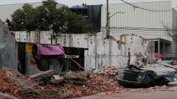 A damaged wall and a smashed vehicle are pictured after an earthquake in Mexico City, Mexico September 8, 2017. REUTERS/Carlos Jasso