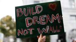 FILE PHOTO: A sign is seen during a rally against the rescindment of DACA (Deferred Action for Childhood Arrivals) program outside the San Francisco Federal Building in San Francisco, California, U.S., September 5, 2017. REUTERS/Stephen Lam