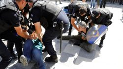 Riot police detain protesters during the trial of two Turkish teachers, who went on a hunger strike over their dismissal under a government decree following last year's failed coup, outside of a courthouse in Ankara, Turkey, September 14, 2017. REUTERS/Umit Bektas