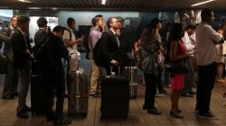 People wait in line to purchase New York subway MetroCards at Pennsylvania Station in New York City, U.S., June 12, 2017. REUTERS/Shannon Stapleton