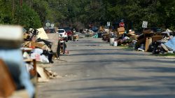 FILE PHOTO: Flood-damaged contents from people's homes line the street following the aftermath of tropical storm Harvey in Wharton, Texas, U.S., September 6, 2017. REUTERS/Mike Blake/File Photo