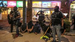 Police detain protesters arrested for causing damage to local businesses during the second night of demonstrations after a not guilty verdict in the murder trial of former St. Louis police officer Jason Stockley, charged with the 2011 shooting of Anthony Lamar Smith, who was black, in St. Louis, Missouri, U.S., September 16, 2017.
