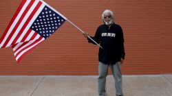FILE PHOTO: Bill Monroe poses for a portrait as he protests the not guilty verdict in the murder trial of Jason Stockley, a former St. Louis police officer charged with the 2011 shooting of Anthony Lamar Smith, in St. Louis, Missouri, U.S., September 17, 2017. REUTERS/Joshua Lott/File Photo