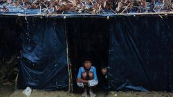 Rohingya refugees sit inside their temporary shelter as it rains at a camp in Cox's Bazar, Bangladesh September 19, 2017. REUTERS/Danish Siddiqui