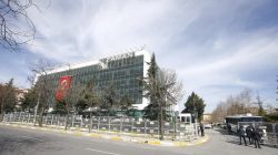FILE PHOTO: Police officers carry security barriers in front of the Zaman newspaper headquarters in Istanbul, Turkey March 6, 2016. REUTERS/ Osman Orsal