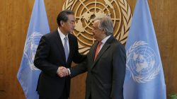 FILE PHOTO: Chinese Foreign Minister Wang Yi (L) shakes hands with United Nations Secretary General Antonio Guterres prior to their meeting at U.N. headquarters in New York, U.S., September 18, 2017. REUTERS/Brendan McDermid