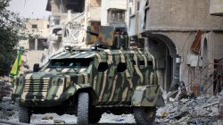 A fighter from Syrian Democratic Forces (SDF) sits in a military tank in Raqqa, Syria September 16, 2017. REUTERS/ Rodi Said