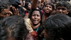 A woman reacts as Rohingya refugees wait to receive aid in Cox's Bazar, Bangladesh, September 21, 2017. REUTERS/Cathal McNaughton