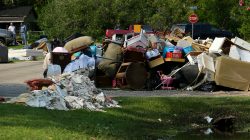 FILE PHOTO: Flood-damaged contents from people's homes line the street following the aftermath of tropical storm Harvey in Wharton, Texas, U.S., September 6, 2017. REUTERS/Mike Blake/File Photo