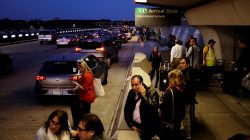 International passengers wait for their rides outside the international arrivals exit at Washington Dulles International Airport in Dulles, Virginia, U.S. September 24, 2017.