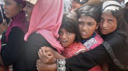 People wait to receive aid in Cox's Bazar, Bangladesh, September 25, 2017.
