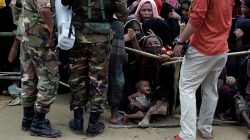 Rohingya refugees queue for aid at Cox's Bazar, Bangladesh, September 26, 2017. REUTERS/Cathal McNaughton