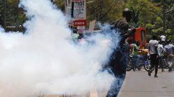 A supporter of the opposition National Super Alliance (NASA) coalition runs after riot policemen dispersed protesters during a demonstration calling for the removal of Independent Electoral and Boundaries Commission (IEBC) officials in Nairobi, Kenya September 26, 2017. REUTERS/Thomas Mukoya