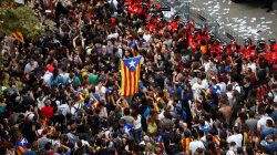 Tens of thousands of Catalans take to streets to protest police action