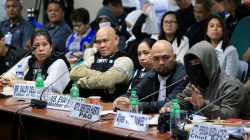A witness to a recent teen killing linked to illegal drugs, wearing a sweatshirt and mask to hide his identity gestures while parents of the killed teenager, wearing bulletproof vests listen during the Senate investigation on illegal drugs at the Senate headquarters in Pasay city, metro Manila, Philippines October 2, 2017. REUTERS/Romeo Ranoco