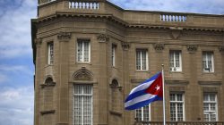 FILE PHOTO - The Cuban national flag is seen raised over their new embassy in Washington July 20, 2015. REUTERS/Carlos Barria/File Photo