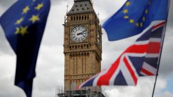 The Union Flag and European Union flags fly near the Elizabeth Tower, housing the Big Ben bell, during the anti-Brexit 'People's March for Europe', in Parliament Square in central London, Britain September 9, 2017. REUTERS/Tolga Akmen