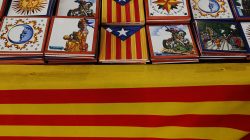 Tiles with the Estelada (Catalan separatist flag) are displayed on a table covered with a Catalan flag at an arts and craft market four days after the banned independence referendum, in Barcelona, Spain October 5, 2017. REUTERS/Susana Vera