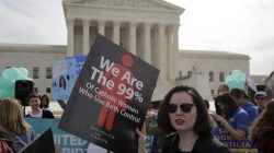 Supporters of contraception rally before Zubik v. Burwell, an appeal brought by Christian groups demanding full exemption from the requirement to provide insurance covering contraception under the Affordable Care Act, is heard by the U.S. Supreme Court in Washington, U.S., March 23, 2016. REUTERS/Joshua Roberts/File Photo