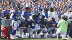 Sep 24, 2017; Orchard Park, NY, USA; Buffalo Bills players kneel in protest during the National Anthem before a game against the Denver Broncos at New Era Field. Mandatory Credit: Timothy T. Ludwig-USA TODAY Sports
