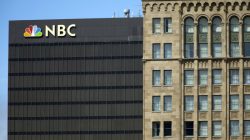 The NBC logo is picture atop their office building in San Diego, California September 1, 2015. REUTERS/Mike Blake - GF10000189520