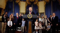 FILE PHOTO: U.S. President Donald Trump calls on Republican Senators to move forward and vote on a healthcare bill to replace the Affordable Care Act, as people negatively affected by the law stand behind him, in the Blue Room of the White House in Washington, U.S., July 24, 2017. REUTERS/Joshua Roberts
