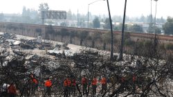 Fierce winds stir deadly California wildfires as teams search for victims