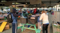 Volunteers and evacuees who work in the region's tourism and wine industries, sift through clothing at a shelter in Petaluma, California, U.S., October 13, 2017. REUTERS/Noel Randewich