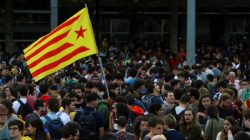 Students wave an Estelada (Catalan separatist flag) during a gathering to protest against the imprisonment of leaders of two of the largest Catalan separatist organizations, Catalan National Assembly's Jordi Sanchez and Omnium's Jordi Cuixart, who were jailed by Spain's High Court, in Barcelona, Spain, October 17, 2017. REUTERS/Ivan Alvarado