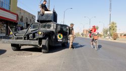 A cyclist gestures at Iraqi security forces, on a street of Kirkuk, Iraq October 19, 2017. REUTERS/Ako Rasheed - RC1433BB18F0