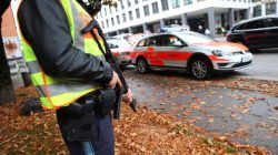 A German police officer guards the site where earlier a man injured several people in a knife attack in Munich, Germany, October 21, 2017. REUTERS/Michael Dalder
