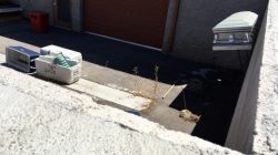 A coffin, mops and coolers used to transport body parts lie in an abandoned courtyard outside a warehouse once shared by a funeral home and the body broker Southern Nevada Donor Services in suburban Las Vegas, Nevada, U.S. July 19, 2016. REUTERS/John Shiffman