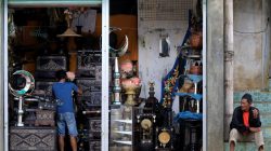A worker cleans-up displayed antiques for sale inside a store in Marawi city, southern Philippines October 26, 2017. REUTERS/Romeo Ranoco
